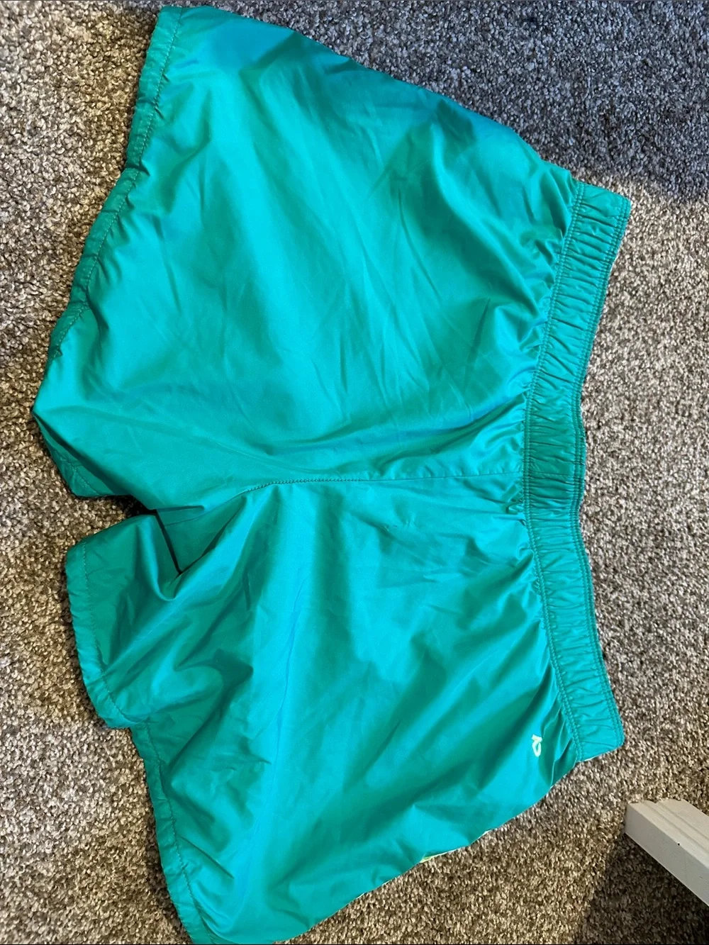 Nike Teal Running Shorts with Yellow Accent